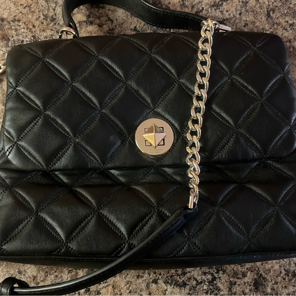 Kate Spade black purse. Can be worn as cross body or one shoulder. Carried twice